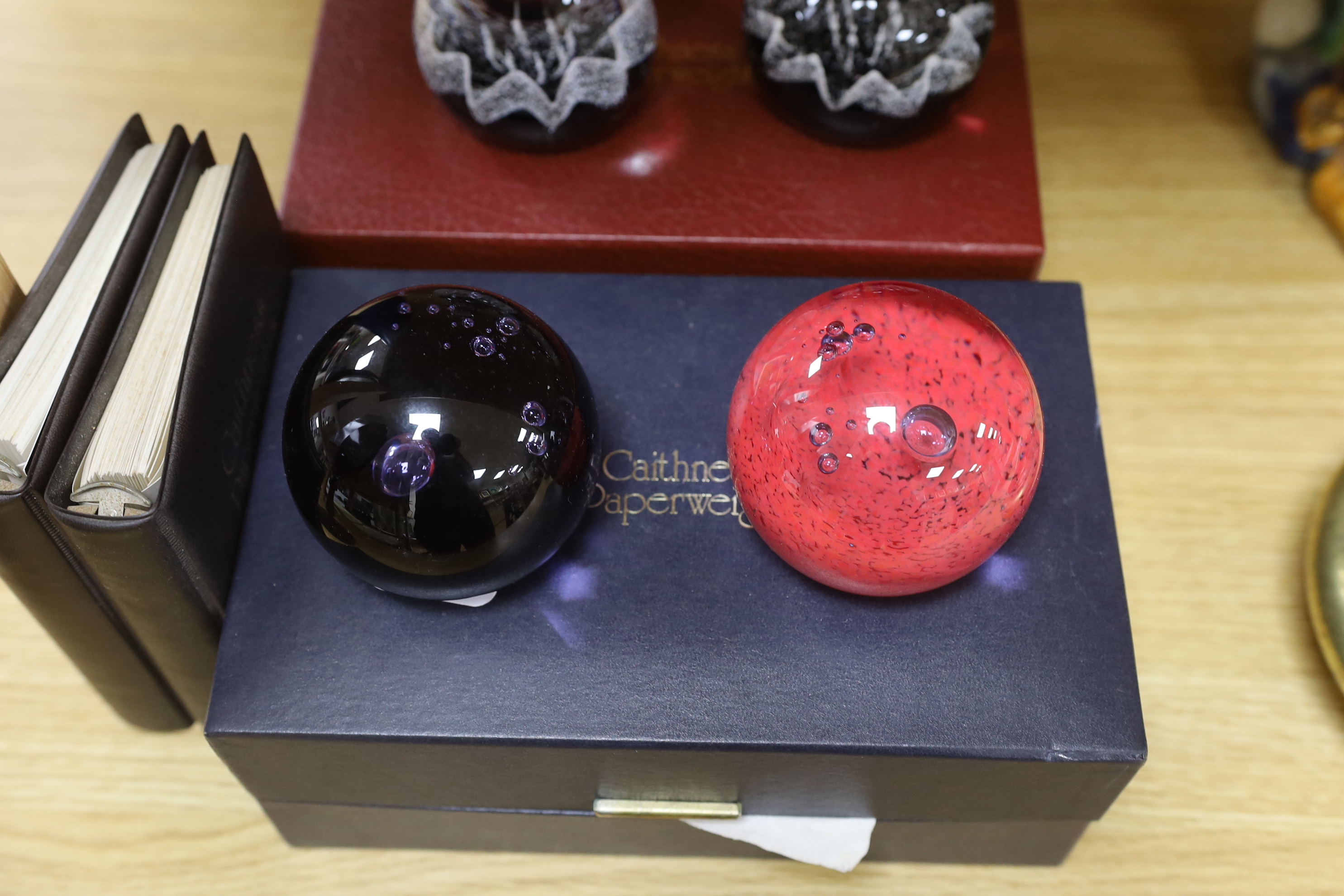 Caithness, three boxed sets comprising scent bottles and paperweights together with two Caithness Collector's Guides, each with boxes, limited editions, the largest 15cm high